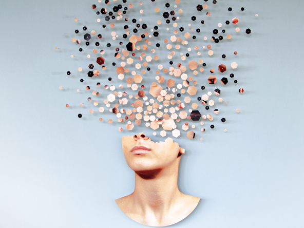 an image of a woman with the top of her head fragmenting into small hexagons