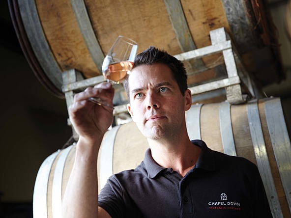 photo of wine expert checking a glass of chapel down wine