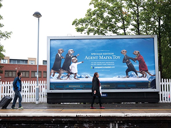 compare the market advert of a train station billboard