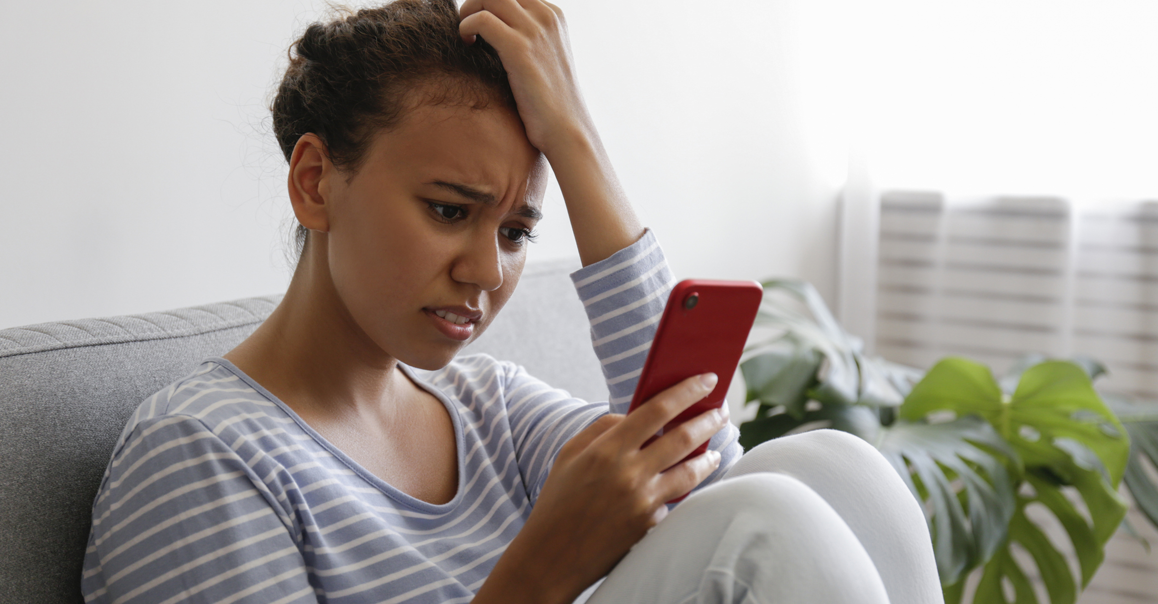 Woman-looking-at-phone-RL-26